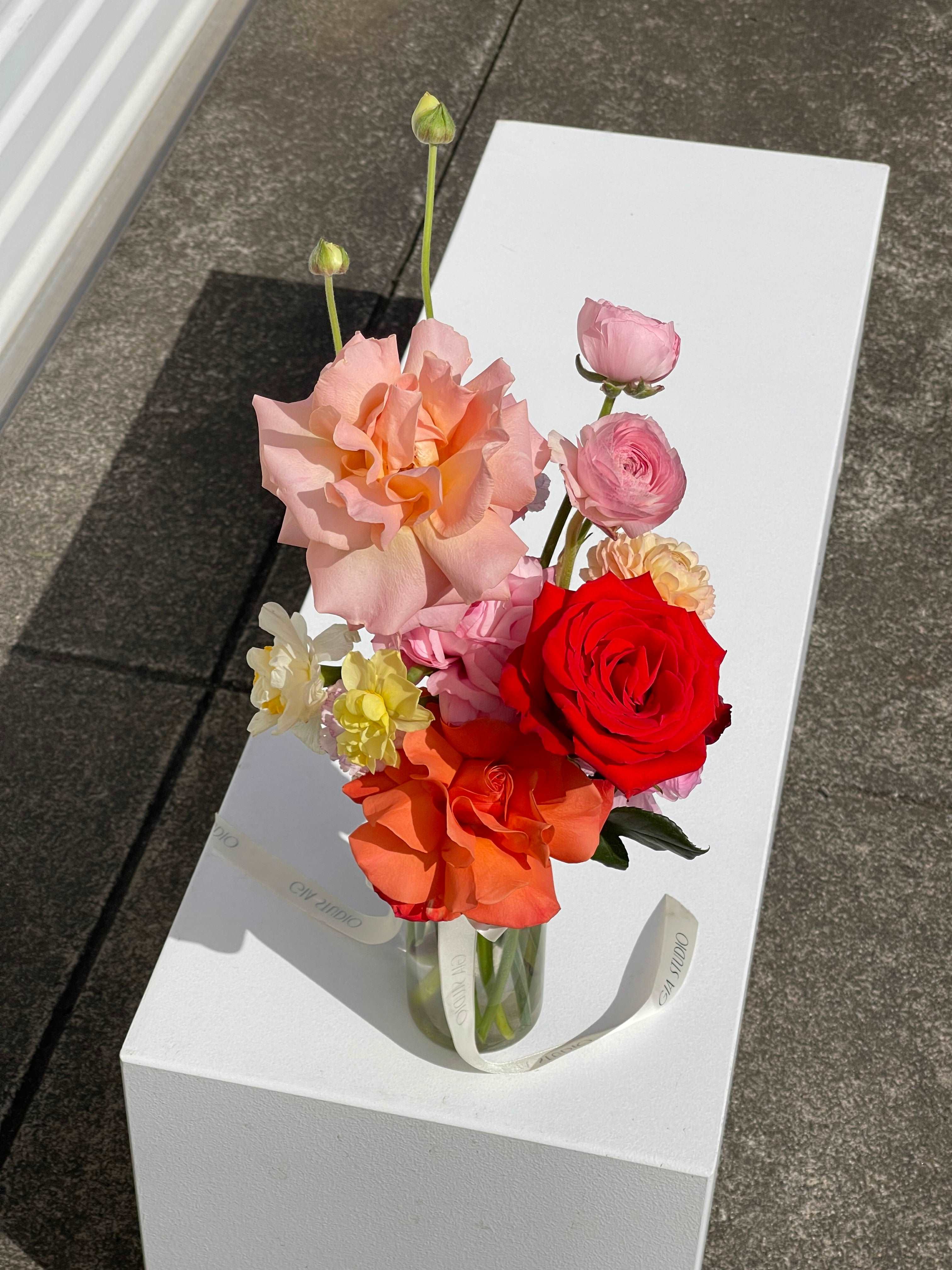 Gia Studio - Daily Vase with reflexed roses, tulips, and seasonal blooms in bubble vase. 