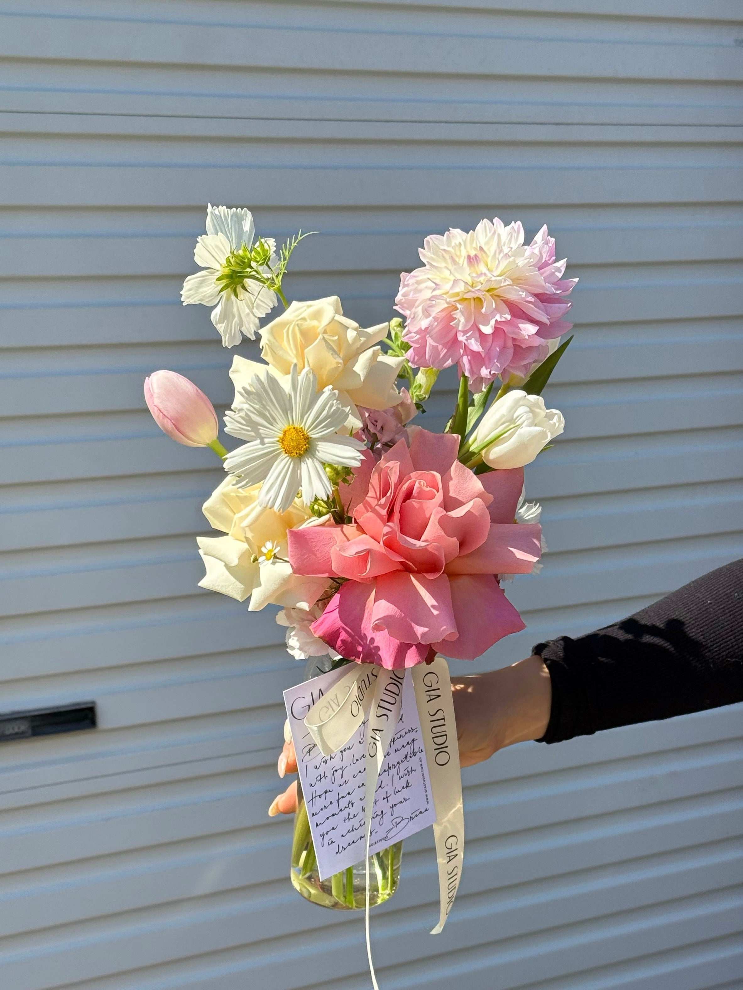 Gia Studio - Daily Vase with reflexed roses, tulips, and seasonal blooms in bubble vase. 